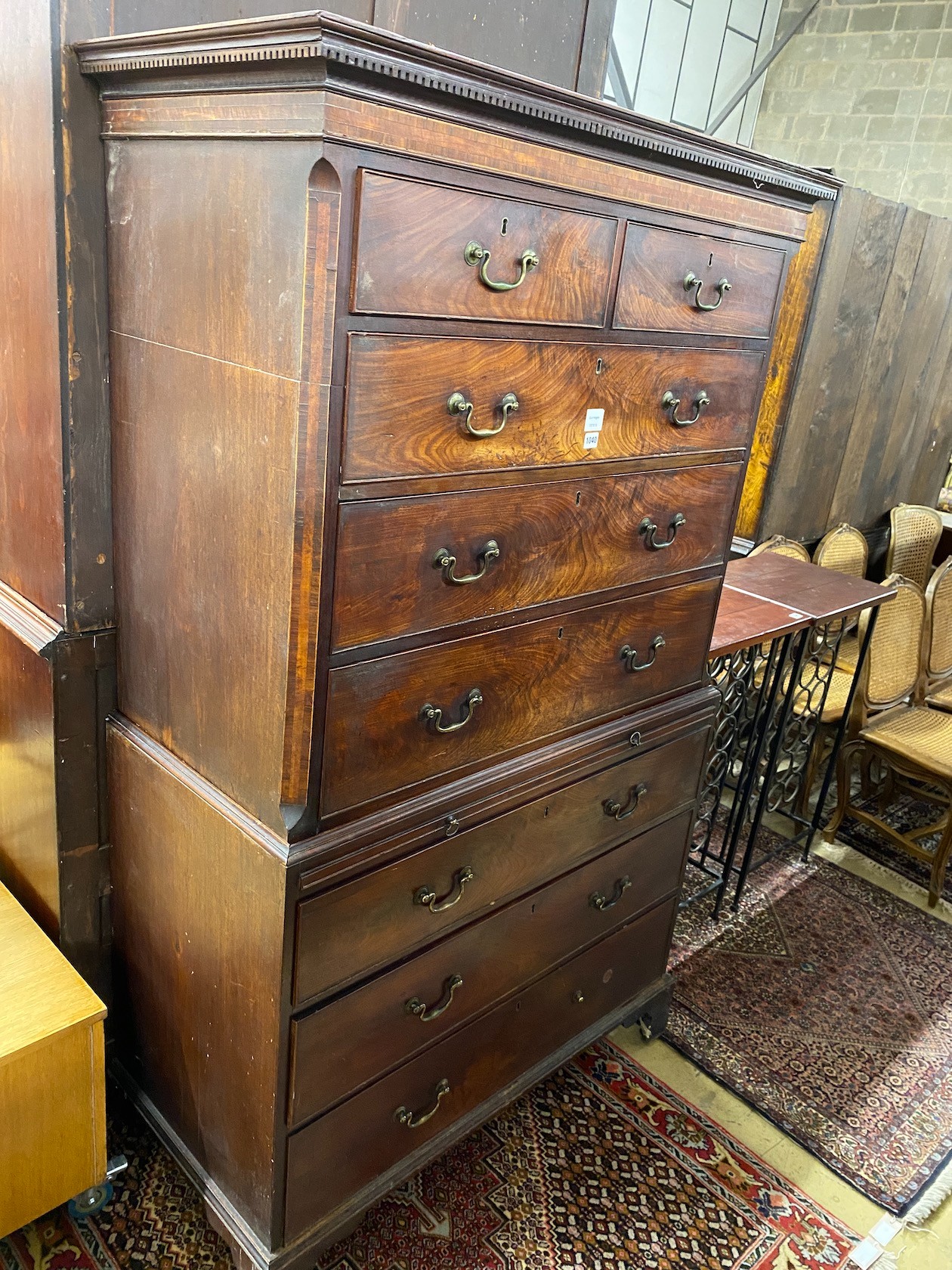 A George III mahogany chest on chest with brushing slide, width 110cm, depth 54cm, height 185cm